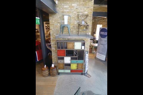 The store uses recycled bricks to create features such as the lift shaft